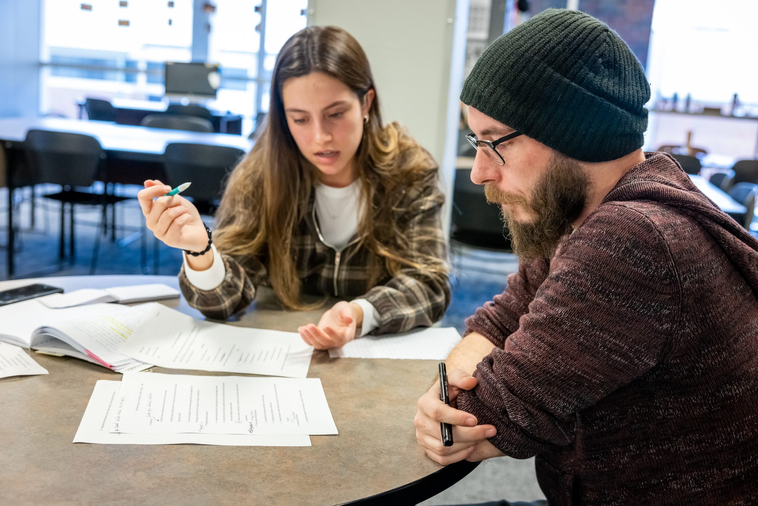 Two students revising a written document